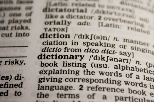 Detailed close-up view of a dictionary page highlighting the word 'dictionary' and its definition.